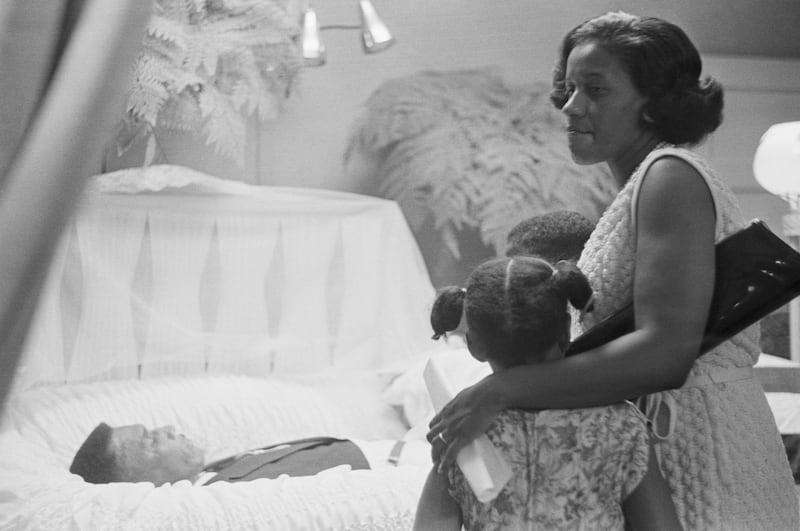 Myrlie Evers views the body of her husband, assassinated Civil Rights leader Medgar Evers, during his funeral in Jackson, Mississippi.