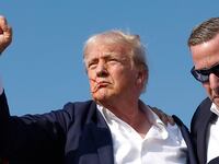 Republican presidential candidate former President Donald Trump pumps his fist