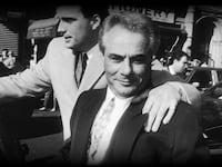A black and white photo of John Gotti
