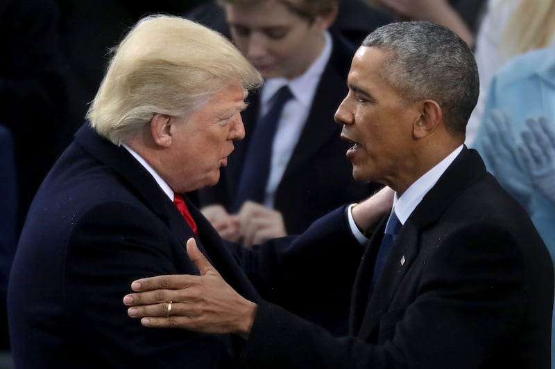 Former U.S. President Barack Obama (R) and U.S. President Donald Trump in 2017.