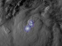 Lightning flashes in Tropical Storm Idalia as it is forecast to intensify into a hurricane before hitting Florida.