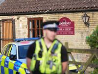 Policeman in front of Johnson's of Old Hurst