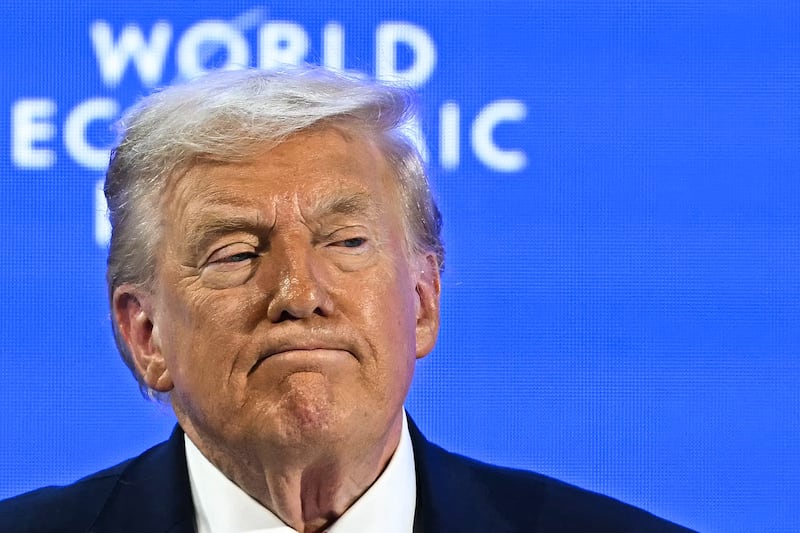 TOPSHOT - US President Donald Trump looks on during the World Economic Forum (WEF) annual meeting in Davos on January 21, 2026. The World Economic Forum takes place in Davos from January 19 to January 23, 2026. (Photo by Fabrice COFFRINI / AFP via Getty Images)