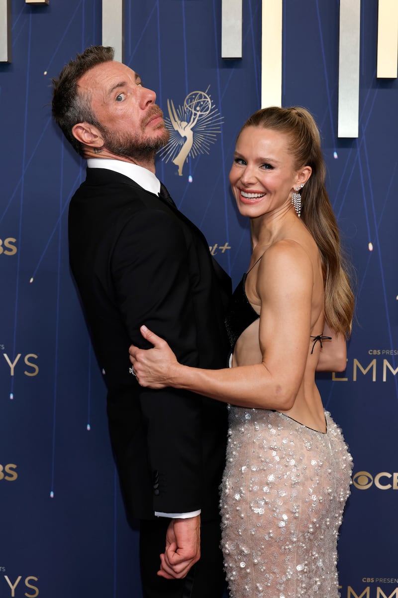 Kristen Bell poses with husband Dax Shepard, with whom she recently celebrated their 12th wedding anniversary by posting a controversial post, quoting Shepard once telling her, "I would never kill you. A lot of men have killed their wives at a certain point. Even though I’m heavily incentivized to kill you, I never would."