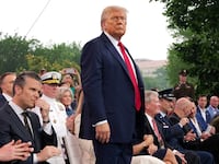 President Donald Trump stands during the celebration of the Army's 250th birthday on the National Mall on June 14, 2025 in Washington, DC. The U.S. Army is marking its 250th anniversary with a military parade along Constitution Avenue that includes roughly 6,600 troops, 150 vehicles, and over 50 aircraft. The parade, which coincides with President Donald Trump's 79th birthday, is designed to tell the history of the Army.
