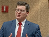Kansas State Treasurer Jake LaTurner talks with members of the 2nd congressional district during meeting at the annual GOP convention in Topeka, Kansas, February 16, 2019.