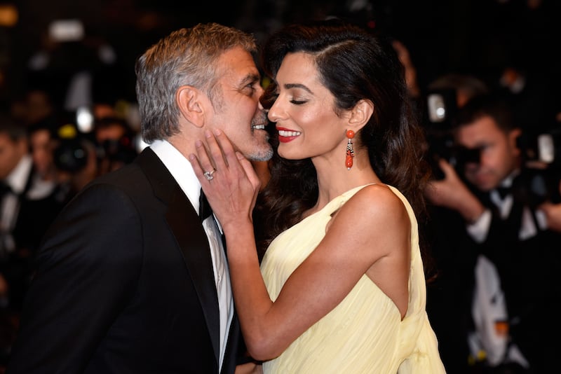 George and Amal Clooney at the 69th annual Cannes Film Festival at the Palais des Festivals on May 12, 2016 in Cannes, France.