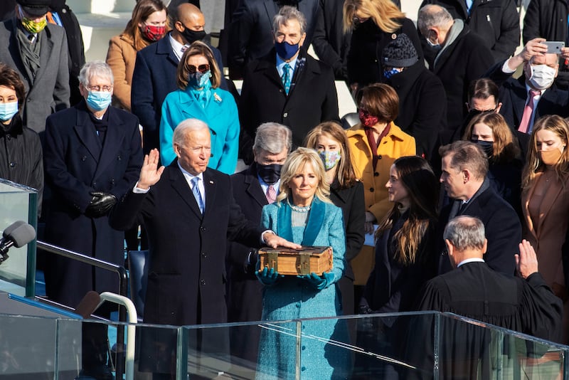 Nancy Pelosi wears a face mask and a light blue jacket at the last presidential inauguration.