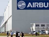 Airbus staff walking near building.