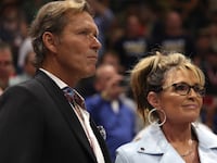 Republican U.S. House candidate and former Alaska Governor Sarah Palin stands with her boyfriend, former NHL star Ron Duguay, during a "Save America" rally at the Alaska Airlines Center in 2022.