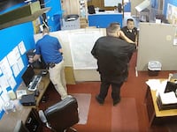 Marion Police Department seizing items from Marion County Record's office.