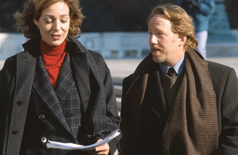 (l-r) Allison Janney as Claudia Jean 'C.J.' Cregg and Timothy Busfield, right, as Danny Concannon in The West Wing in 1999.