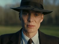 Cillian Murphy as Robert Oppenheimer stares at the camera, looking forlorn.