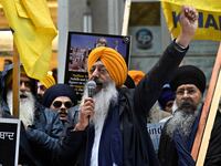 Demonstrators advocating for the creation of Khalistan rally in the street.