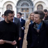 President Volodymyr Zelenskiy holds a letter from King Charles, given to him by Princess Anne, in Kiev, Ukraine.