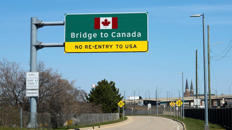 Signs notify drivers at the US-Canada Ambassador Bridge border crossing in Detroit, Michigan on Thursday, April 17, 2025. (Photo by Dominic Gwinn / Middle East Images / Middle East Images via AFP) (Photo by DOMINIC GWINN/ Middle East Images/AFP via Getty Images)