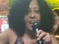 Amarilis Brito Rodríguez singing karaoke.