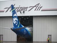Alaska Airlines N704AL is seen grounded in a hangar at Portland International Airport.