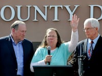 articles/2015/09/08/huckabee-hijacks-kentucky-clerk-kim-davis-s-15-minutes/150908-youngman-kim-davis-tease_xgm4vj