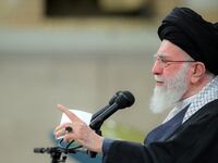 Iran's Supreme Leader Ayatollah Ali Khamenei points his finger while speaking.